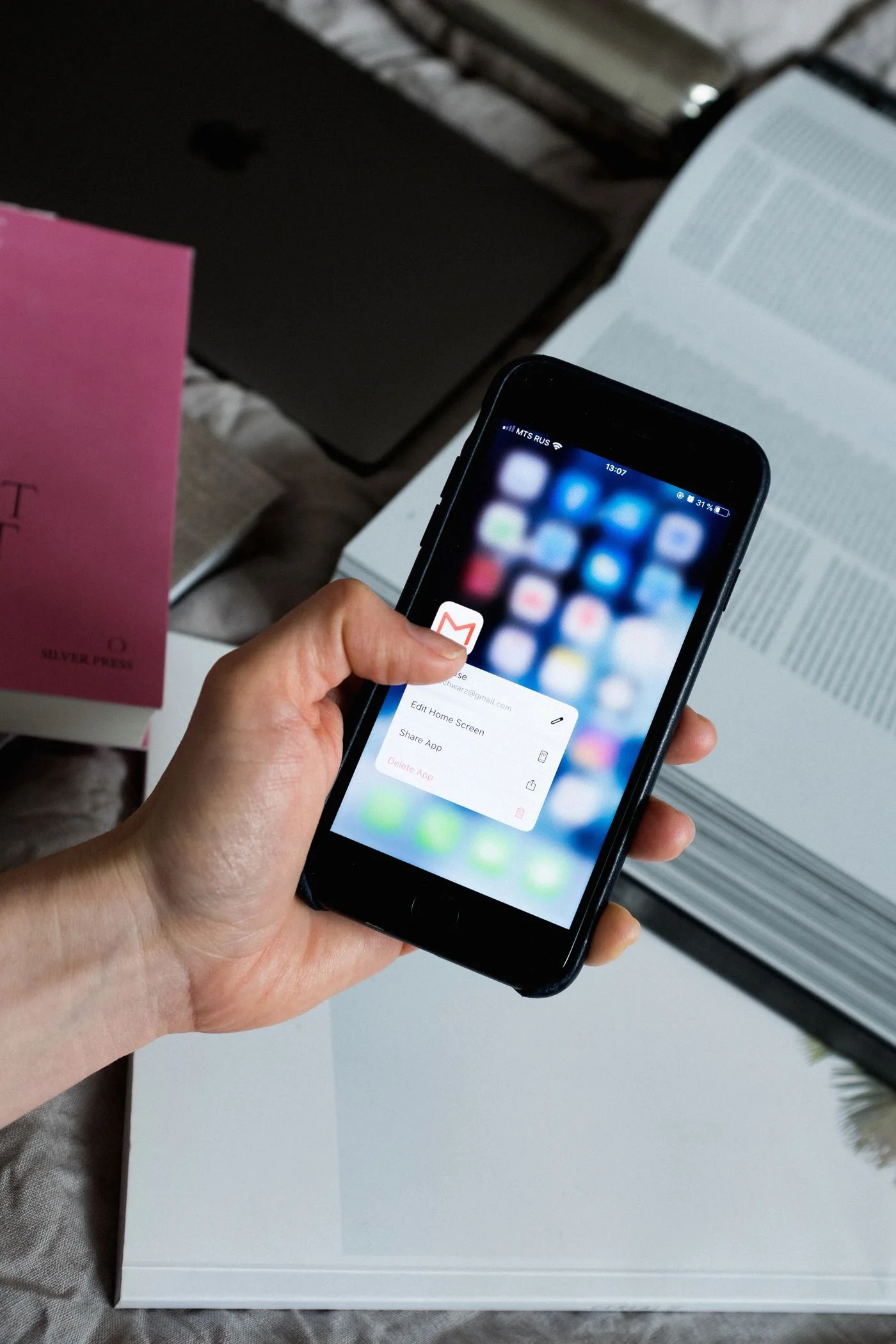 A person checking the screen of a smartphone